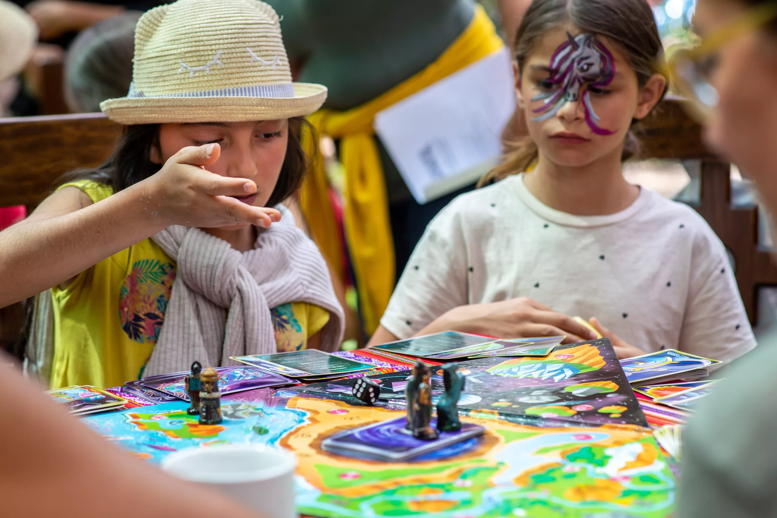 Children engaged in Sacred Worlds gameplay with creative expression