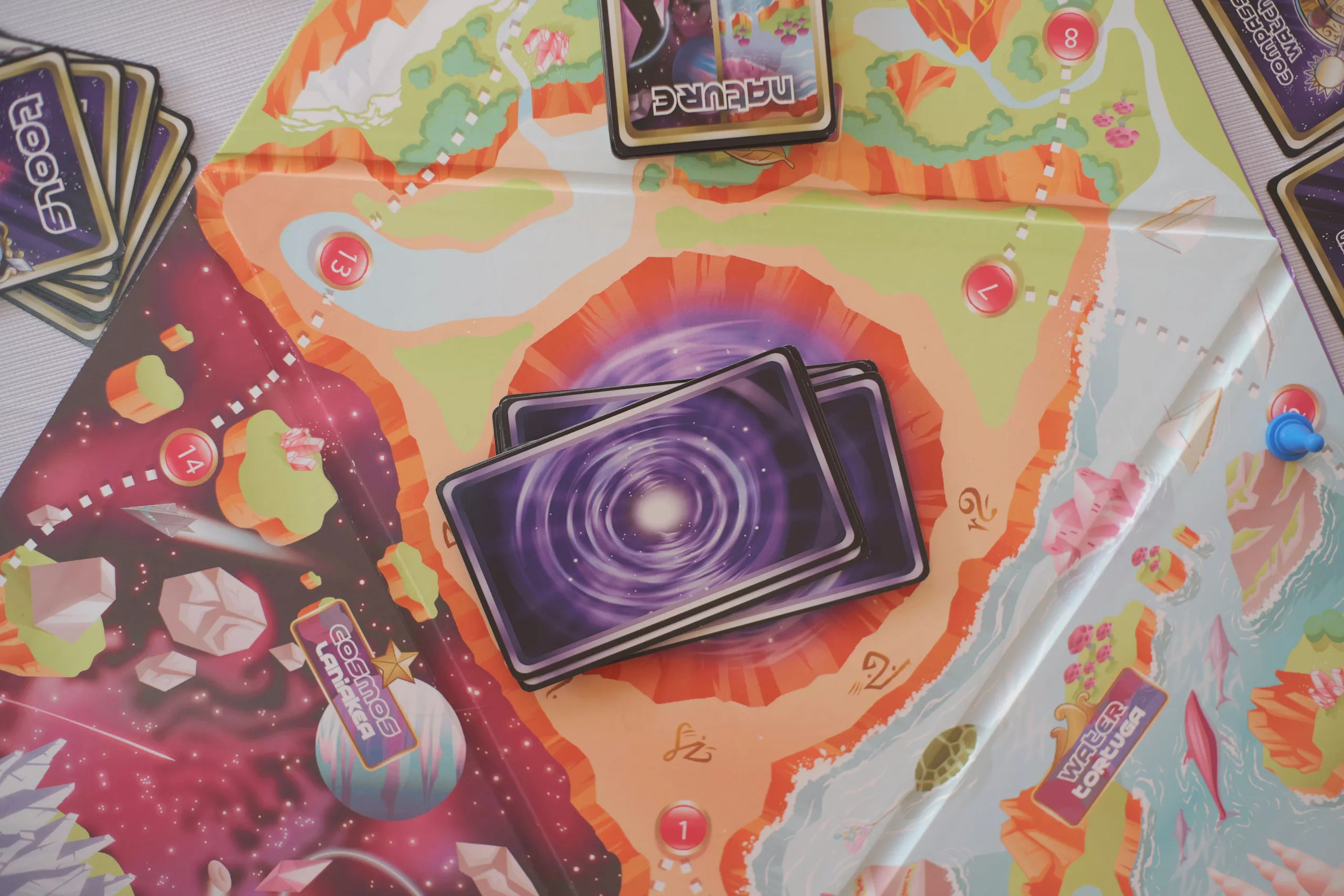 Close-up of Sacred Worlds cosmic portal cards with mystical artwork